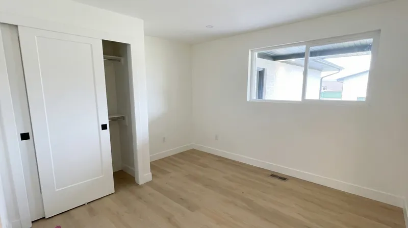 Finished bedroom with closet and LVP flooring